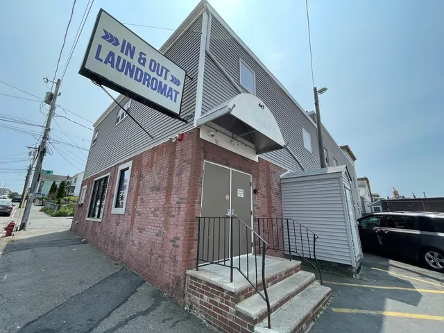 a view of a street with sitting area