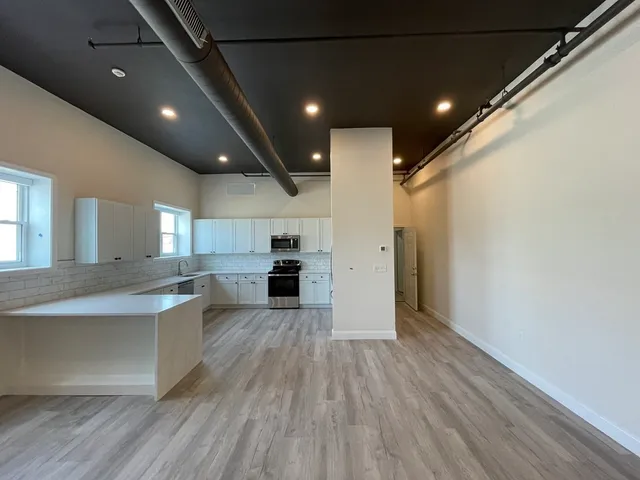 a view of kitchen with cabinets and stainless steel appliances