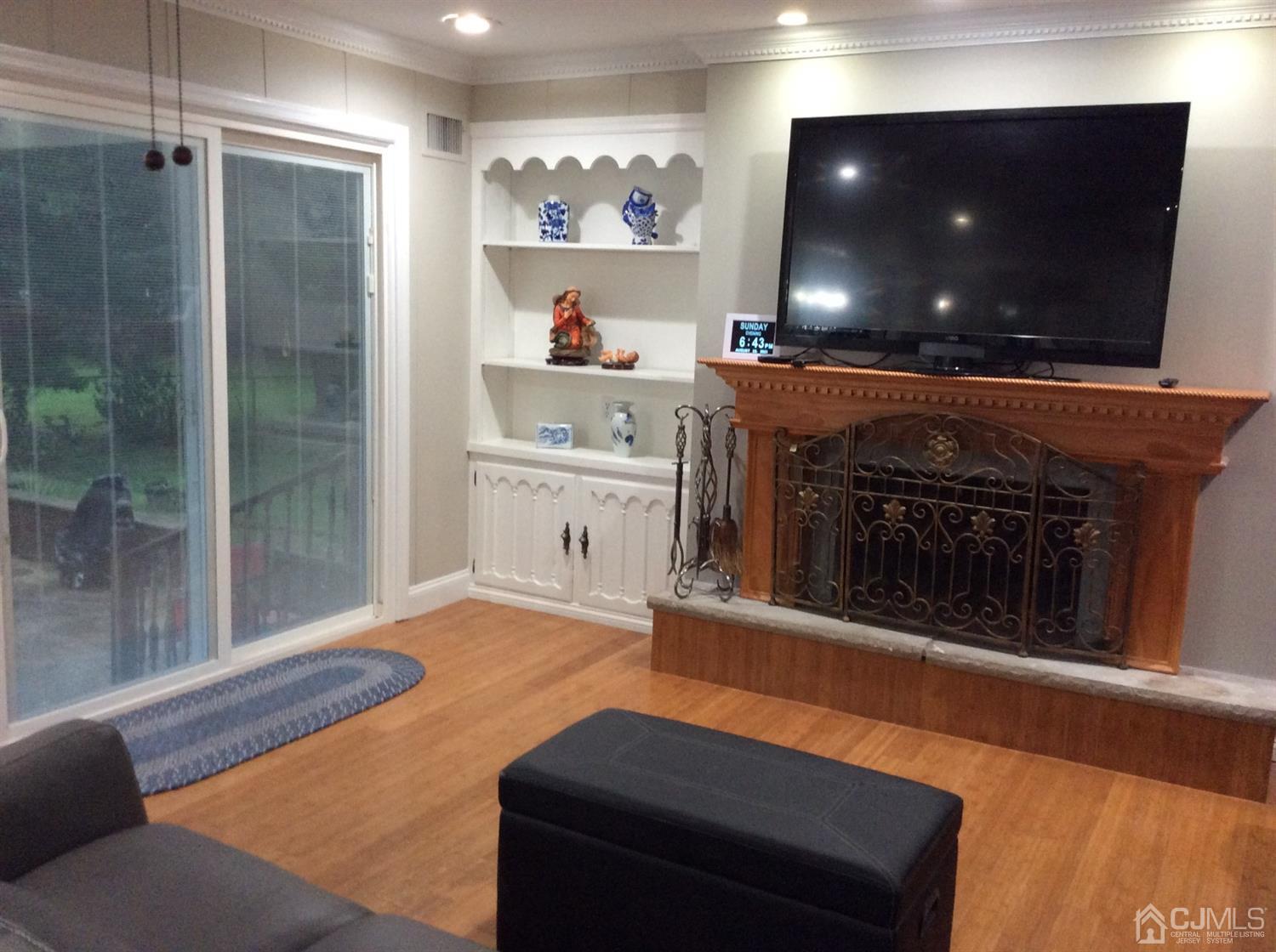 9 Devon Road Edison, NJ 08820 - Photo 14 of 58 a living room with furniture and a flat screen tv