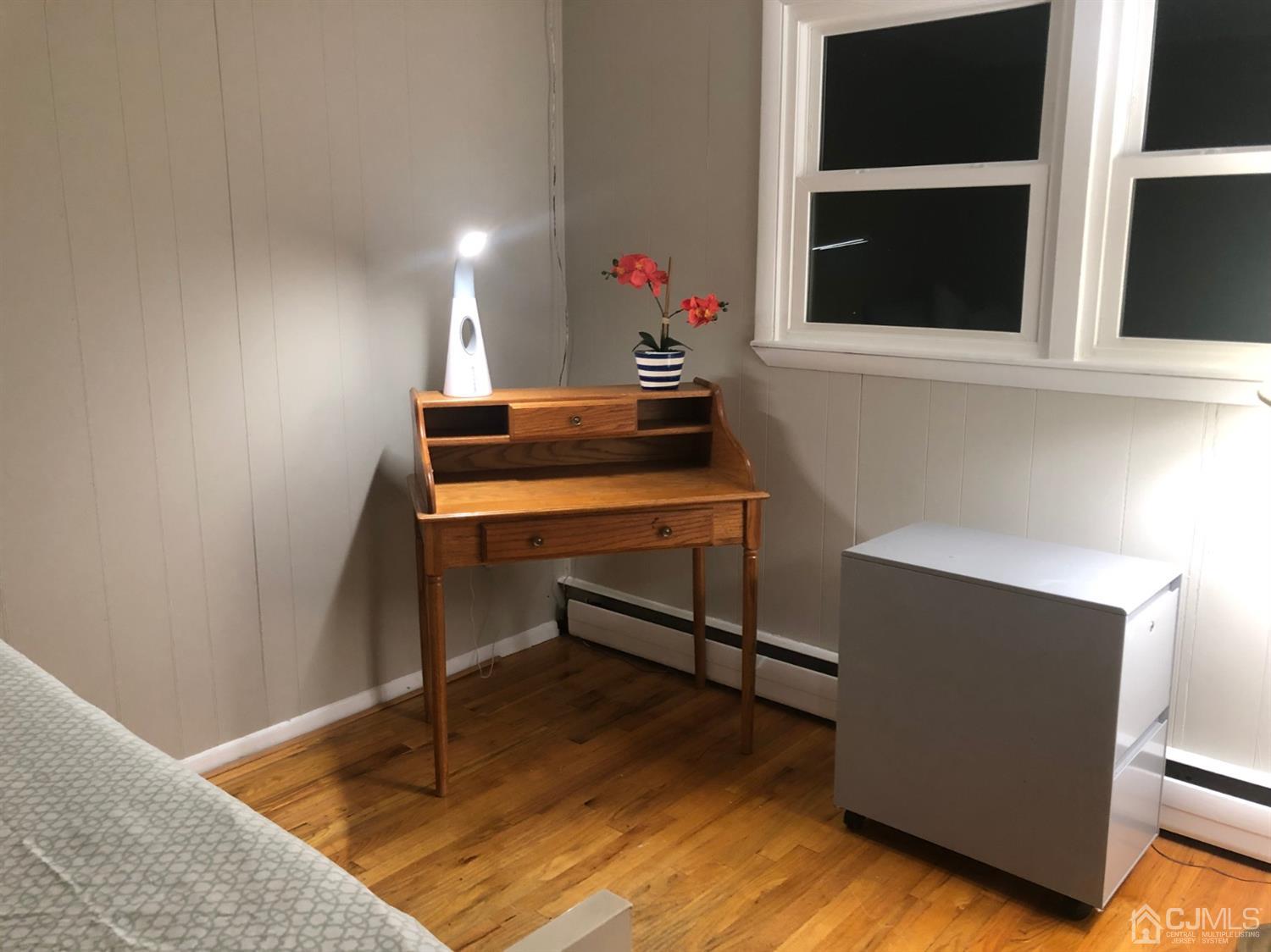 9 Devon Road Edison, NJ 08820 - Photo 18 of 58 a room with wooden floor and potted plant
