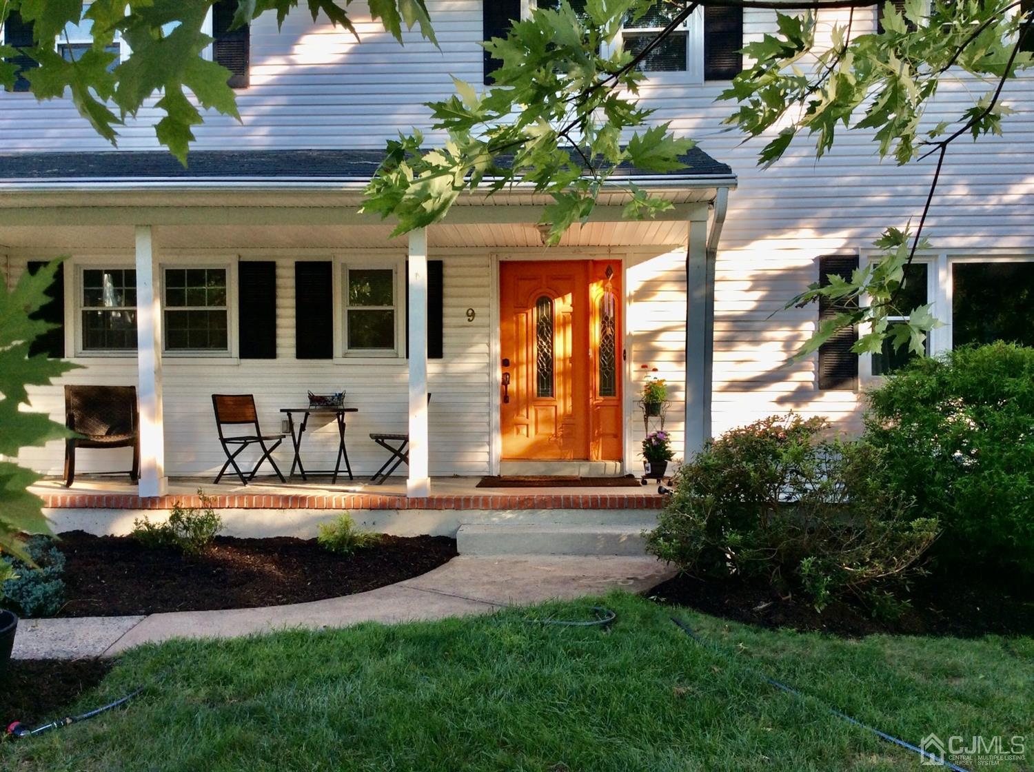 9 Devon Road Edison, NJ 08820 - Photo 3 of 58 a front view of house with yard and green space