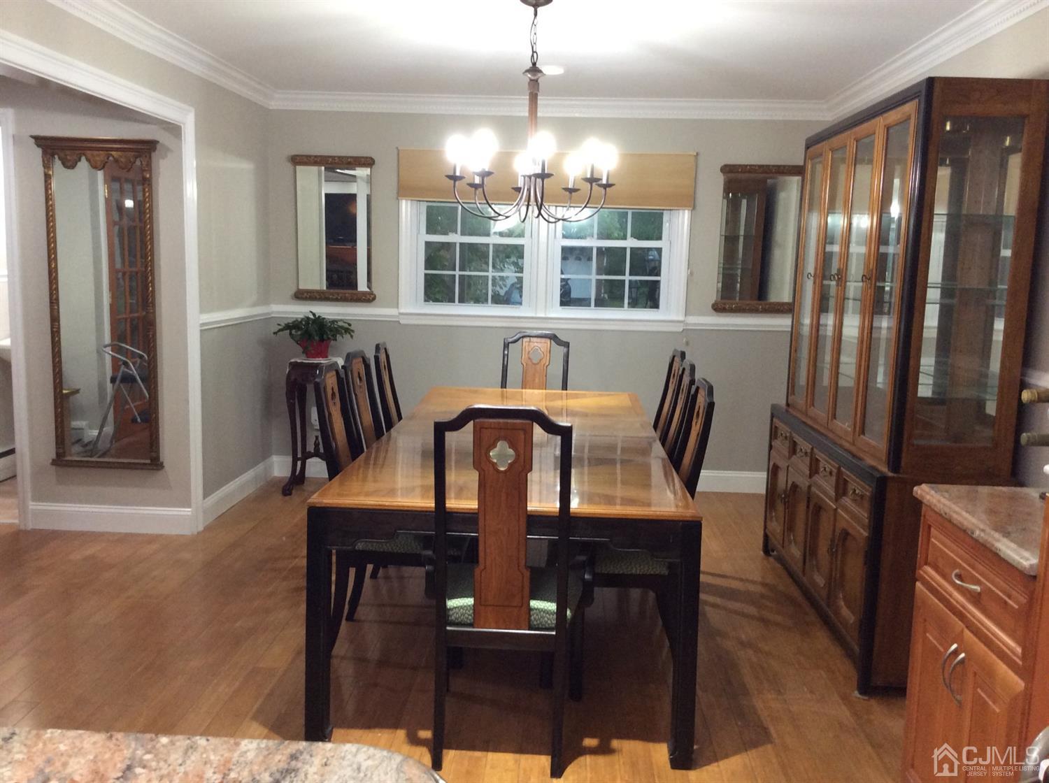 9 Devon Road Edison, NJ 08820 - Photo 27 of 58 a view of a dining room with furniture window and wooden floor