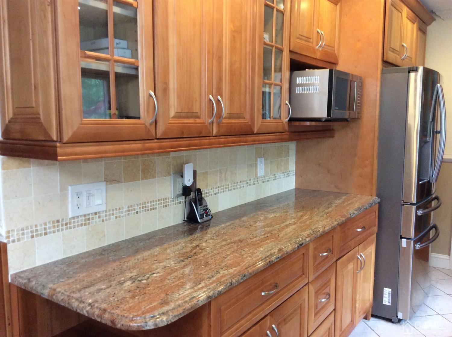 9 Devon Road Edison, NJ 08820 - Photo 28 of 58 a kitchen with granite countertop a sink and a window