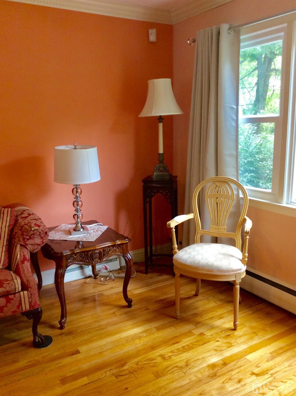 9 Devon Road Edison, NJ 08820 - Photo 32 of 58 a living room with furniture and a chair