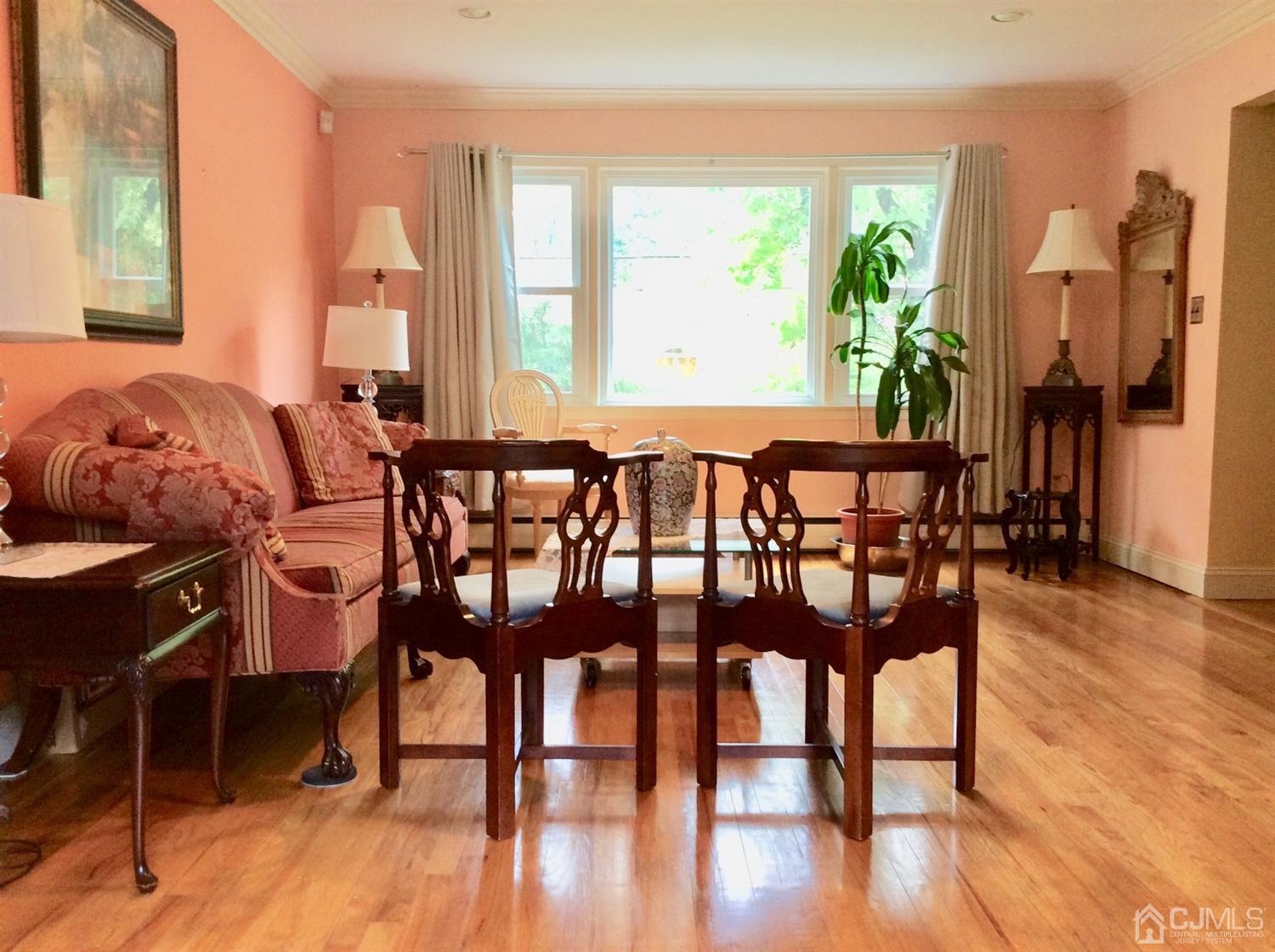 9 Devon Road Edison, NJ 08820 - Photo 35 of 58 a view of a dining room with furniture and wooden floor