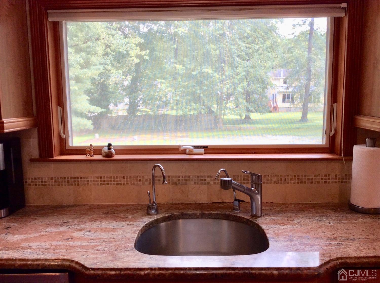 9 Devon Road Edison, NJ 08820 - Photo 41 of 58 a bathroom with a sink and a window