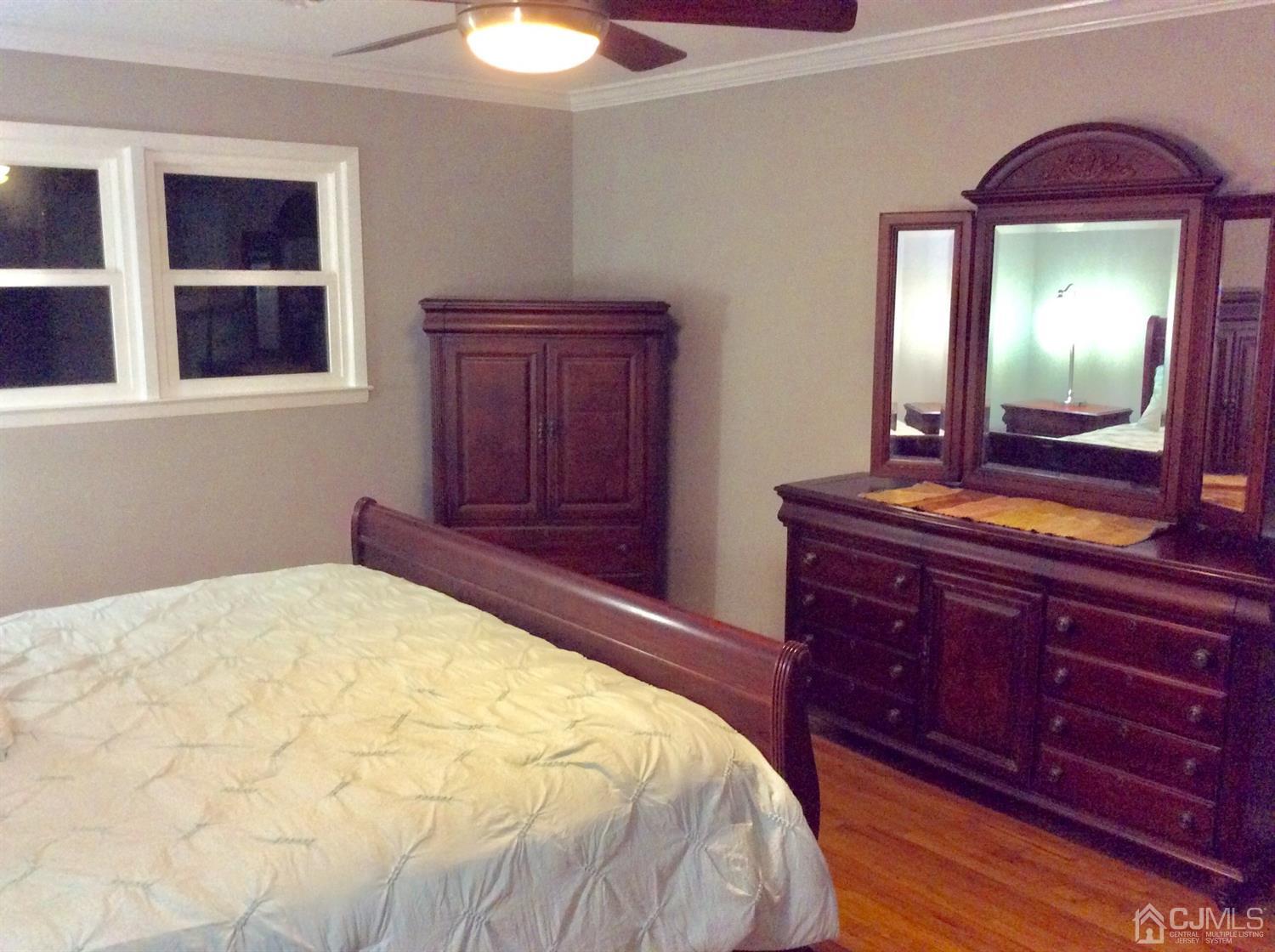 9 Devon Road Edison, NJ 08820 - Photo 48 of 58 a bedroom with a bed and a dresser