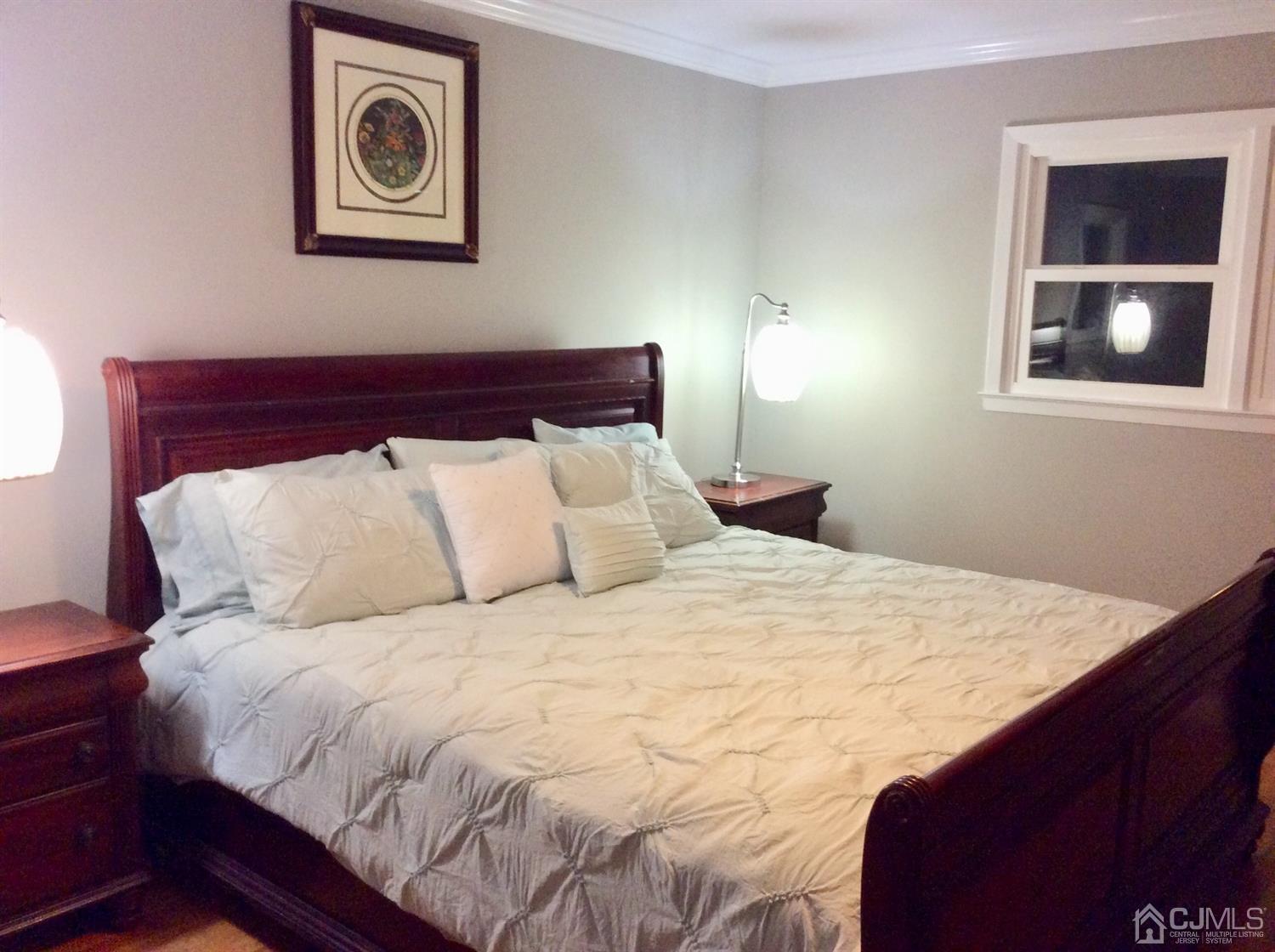 9 Devon Road Edison, NJ 08820 - Photo 49 of 58 a bed sitting in a bedroom next to a window
