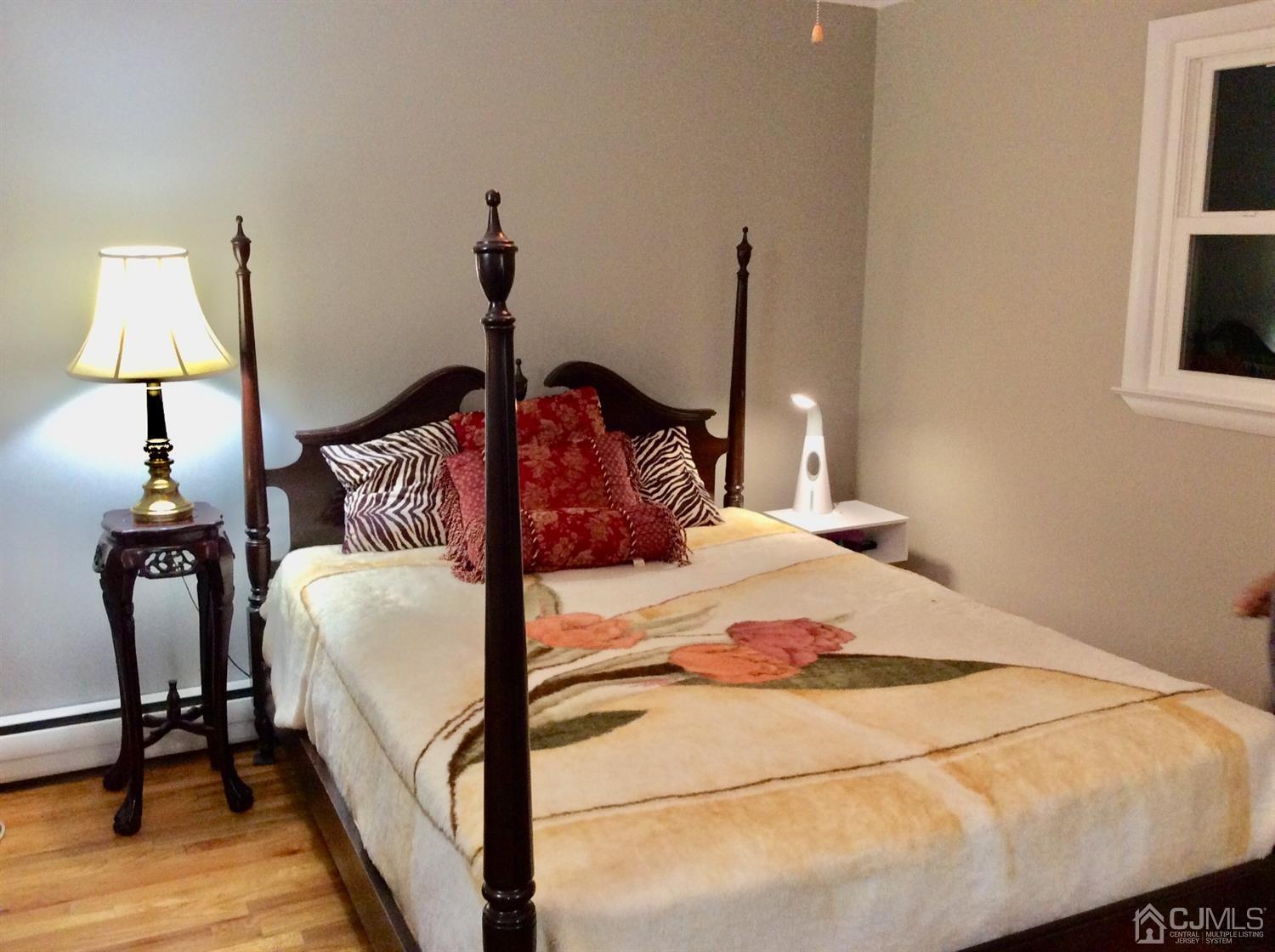 9 Devon Road Edison, NJ 08820 - Photo 51 of 58 a bedroom with bed and wooden floor