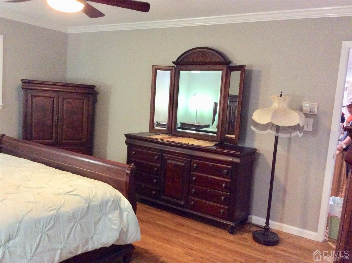 9 Devon Road Edison, NJ 08820 - Photo 55 of 58 a bedroom with a bed and a dresser