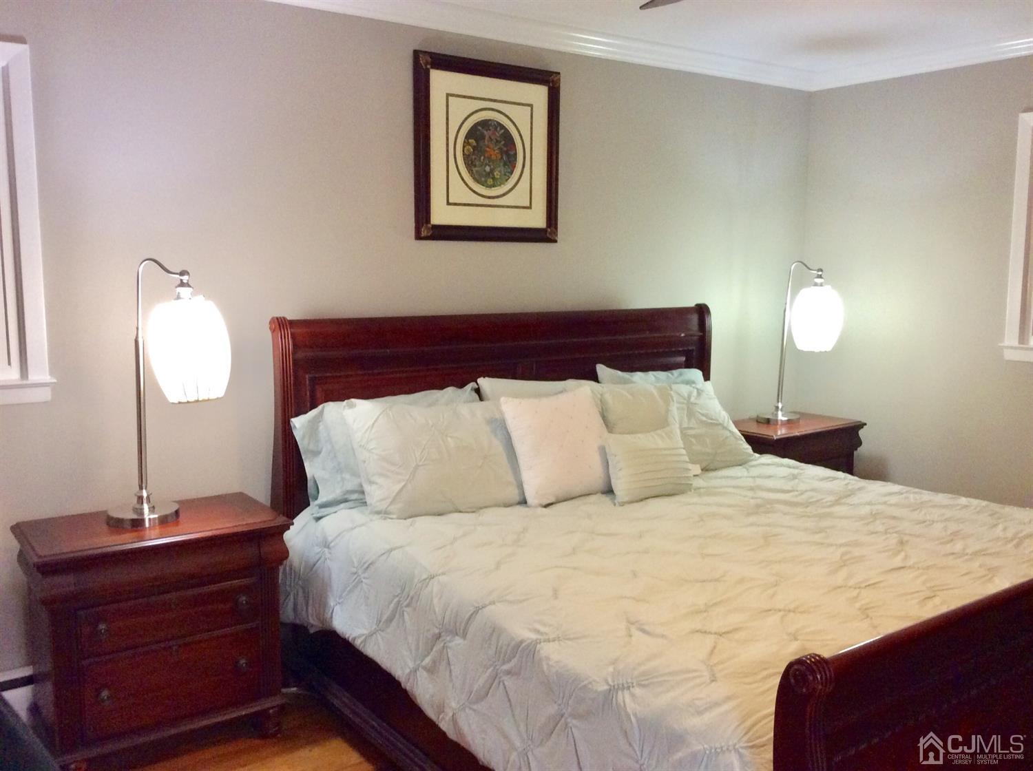 9 Devon Road Edison, NJ 08820 - Photo 57 of 58 a bedroom with a bed and a mirror