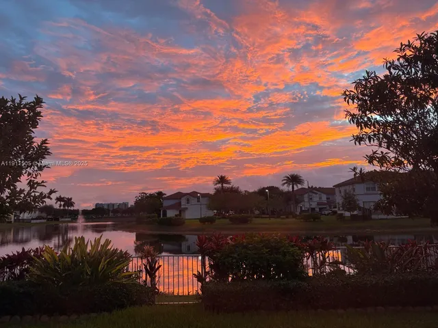 a view of lake with green space