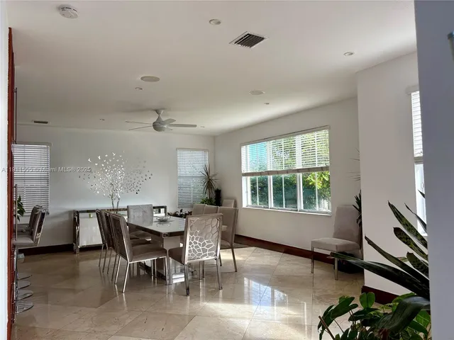 a kitchen with stainless steel appliances granite countertop a refrigerator stove and sink