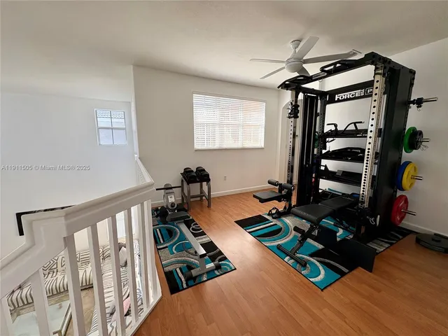 a large bathroom with a double vanity sink mirror and bathtub