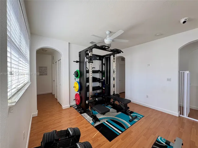 a white toilet sitting next to a bathroom sink