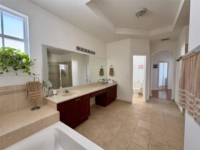 a view of a dining room with furniture and a window