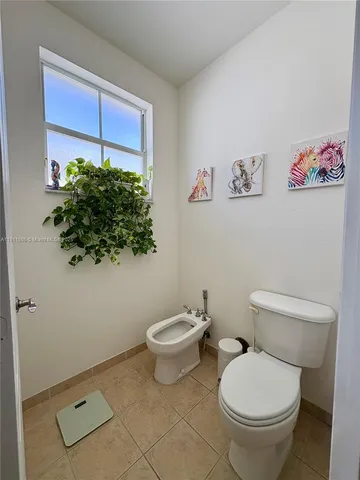 a view of a patio with table and chairs with wooden floor and fence