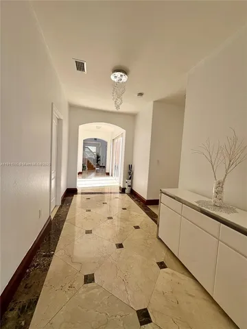 a bedroom with a bed and a table