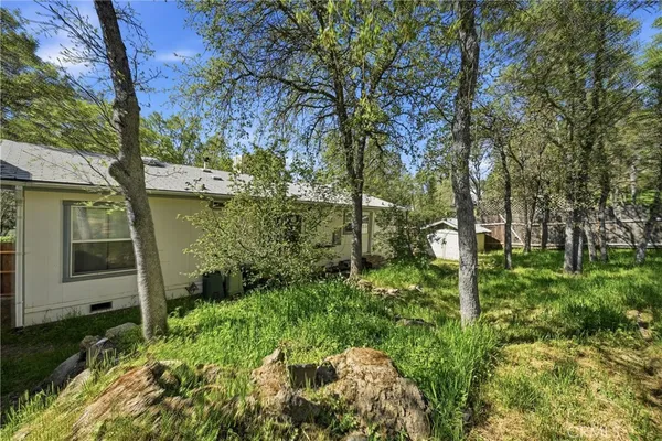 a backyard of a house with lots of green space