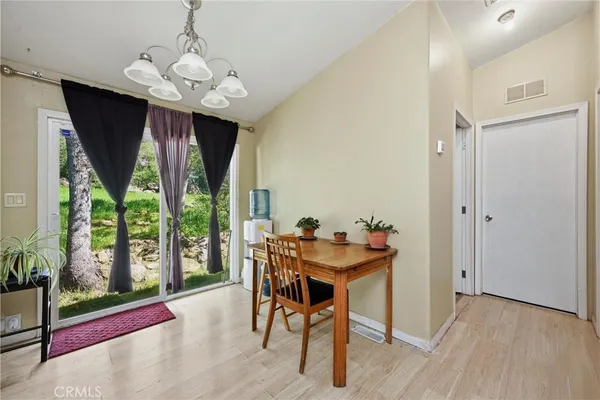 a view of a dining room with furniture window and outside view