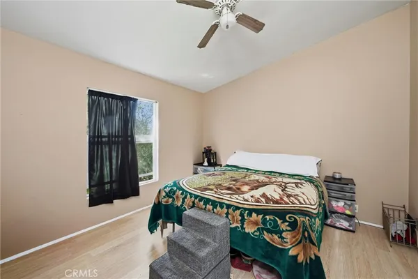 a bedroom with a bed and a table in it