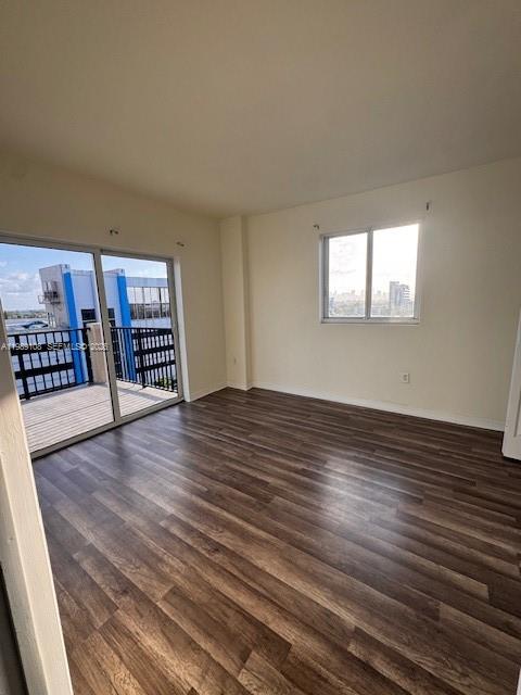 3410 Coral Way, Unit PH01 Miami, FL 33145 - Photo 1 of 10 wooden floor in an empty room with a window