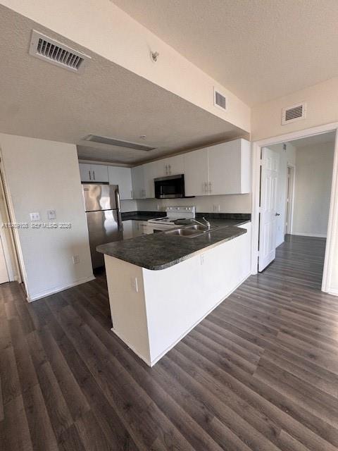 3410 Coral Way, Unit PH01 Miami, FL 33145 - Photo 3 of 10 a kitchen with stainless steel appliances granite countertop a stove a sink and a refrigerator