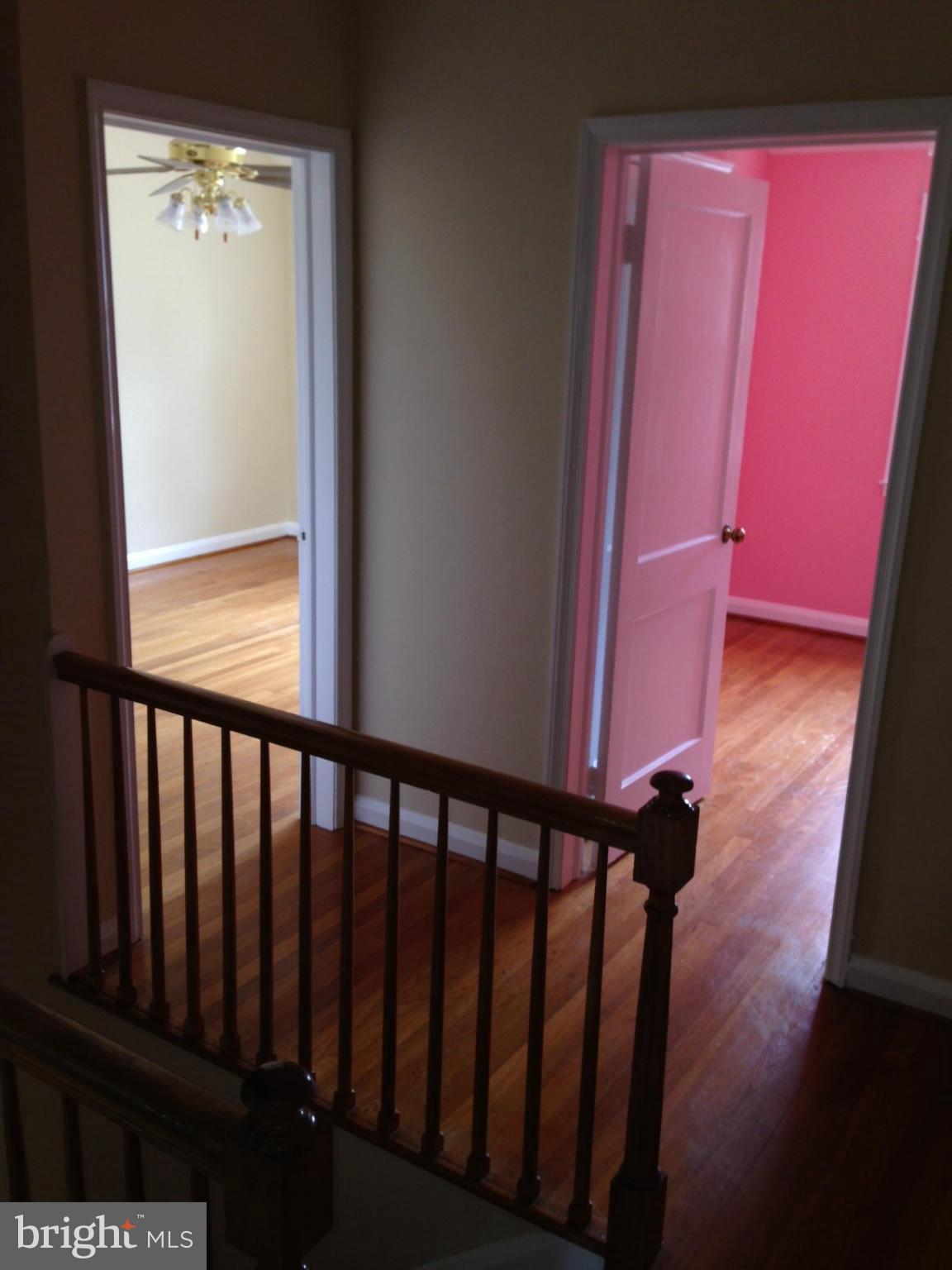 1220 Cedarcroft Road Baltimore, MD 21239 - Photo 13 of 22 a view of a porch with wooden floor