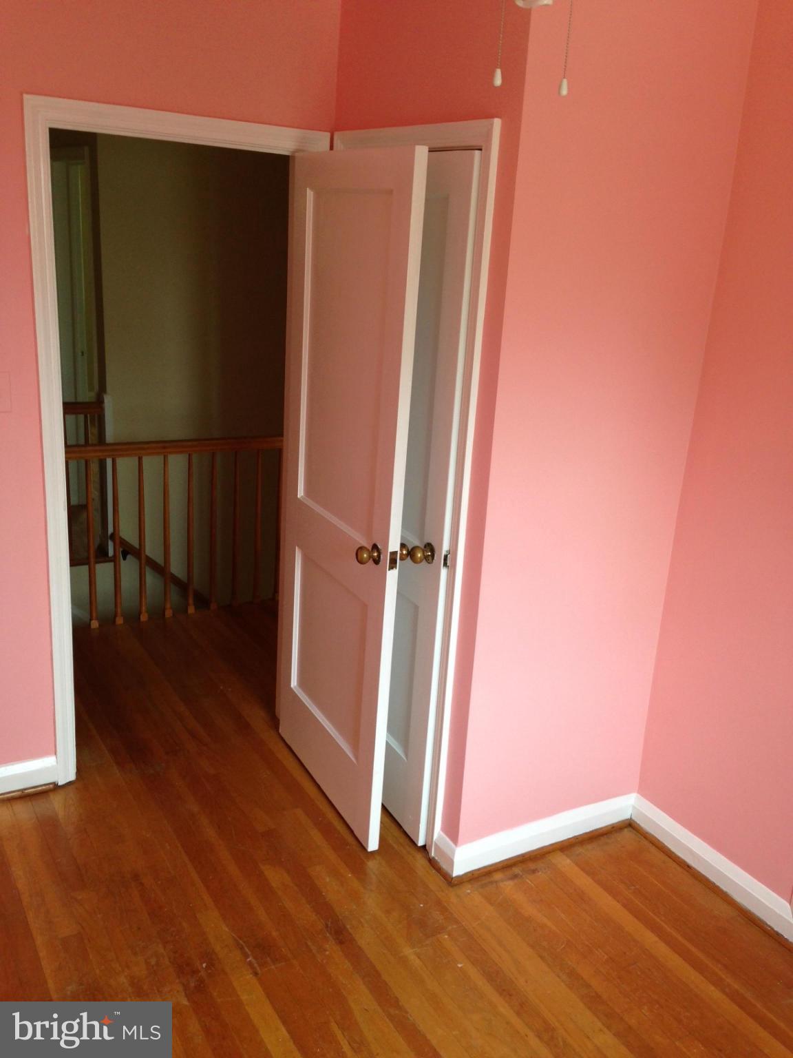 1220 Cedarcroft Road Baltimore, MD 21239 - Photo 17 of 22 a view of a hallway with wooden floor