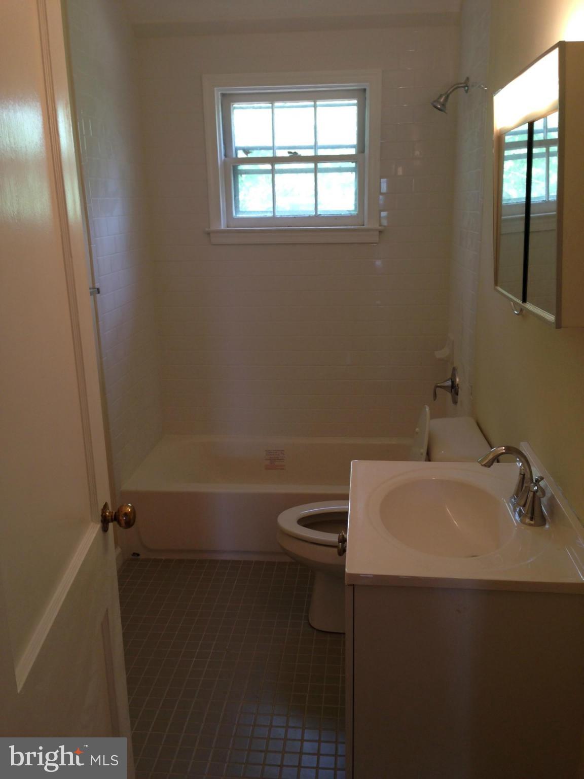 1220 Cedarcroft Road Baltimore, MD 21239 - Photo 18 of 22 a bathroom with a sink and toilet