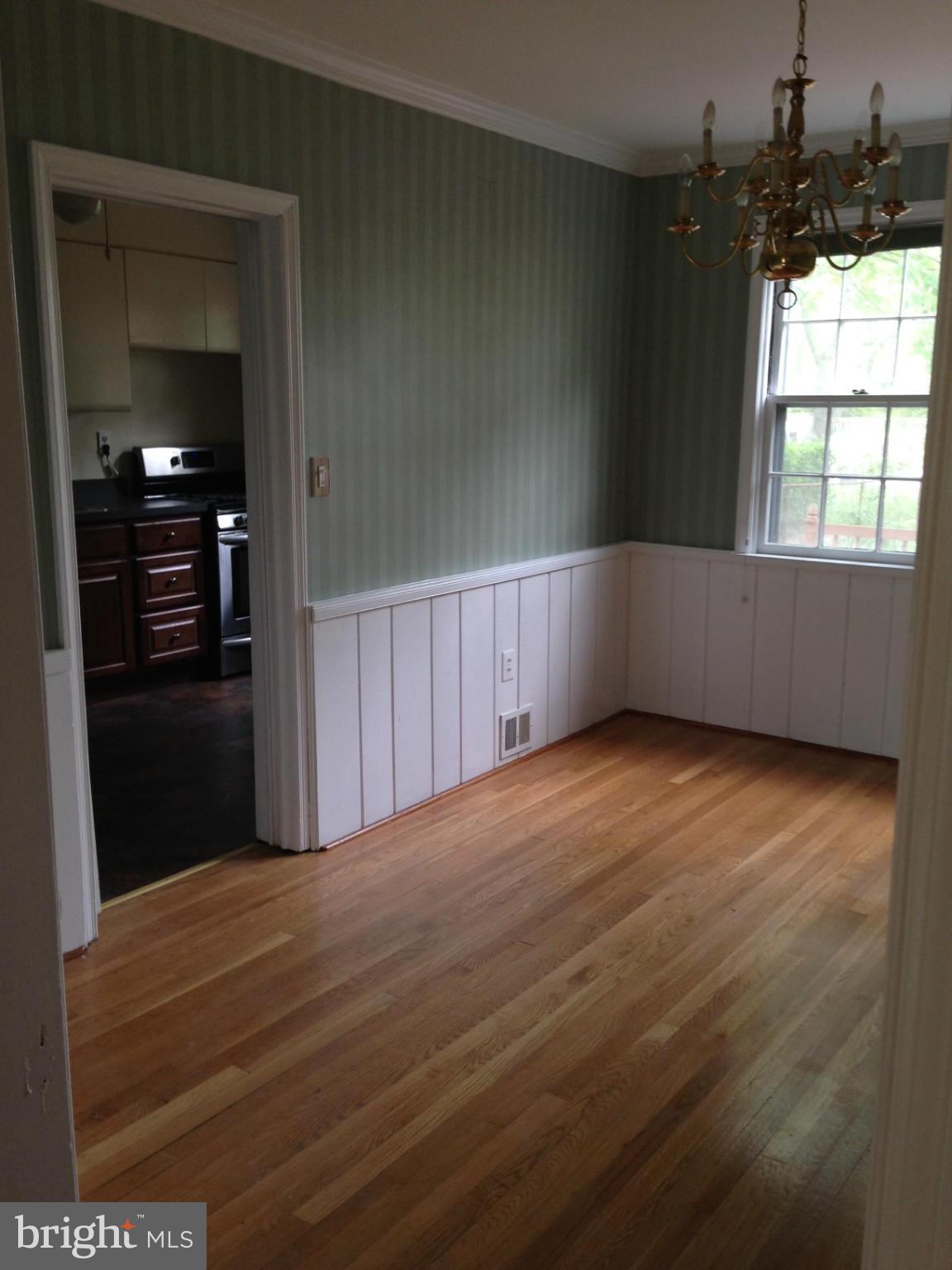 1220 Cedarcroft Road Baltimore, MD 21239 - Photo 6 of 22 a view of an empty room with a window