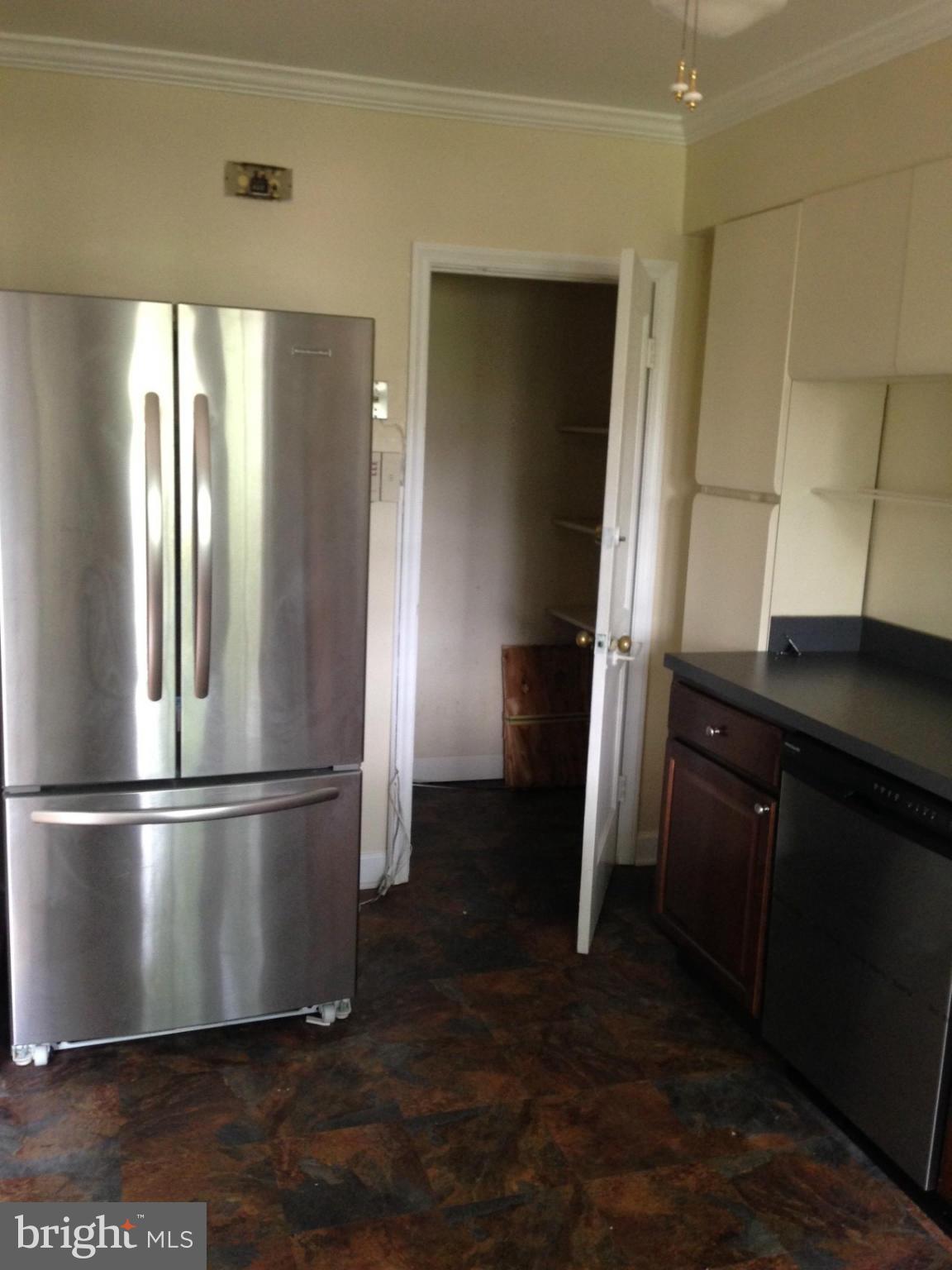 1220 Cedarcroft Road Baltimore, MD 21239 - Photo 8 of 22 a metallic refrigerator freezer sitting in a kitchen