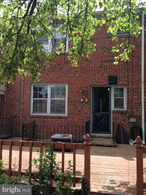 1220 Cedarcroft Road Baltimore, MD 21239 - Photo 9 of 22 a front view of a house with garden