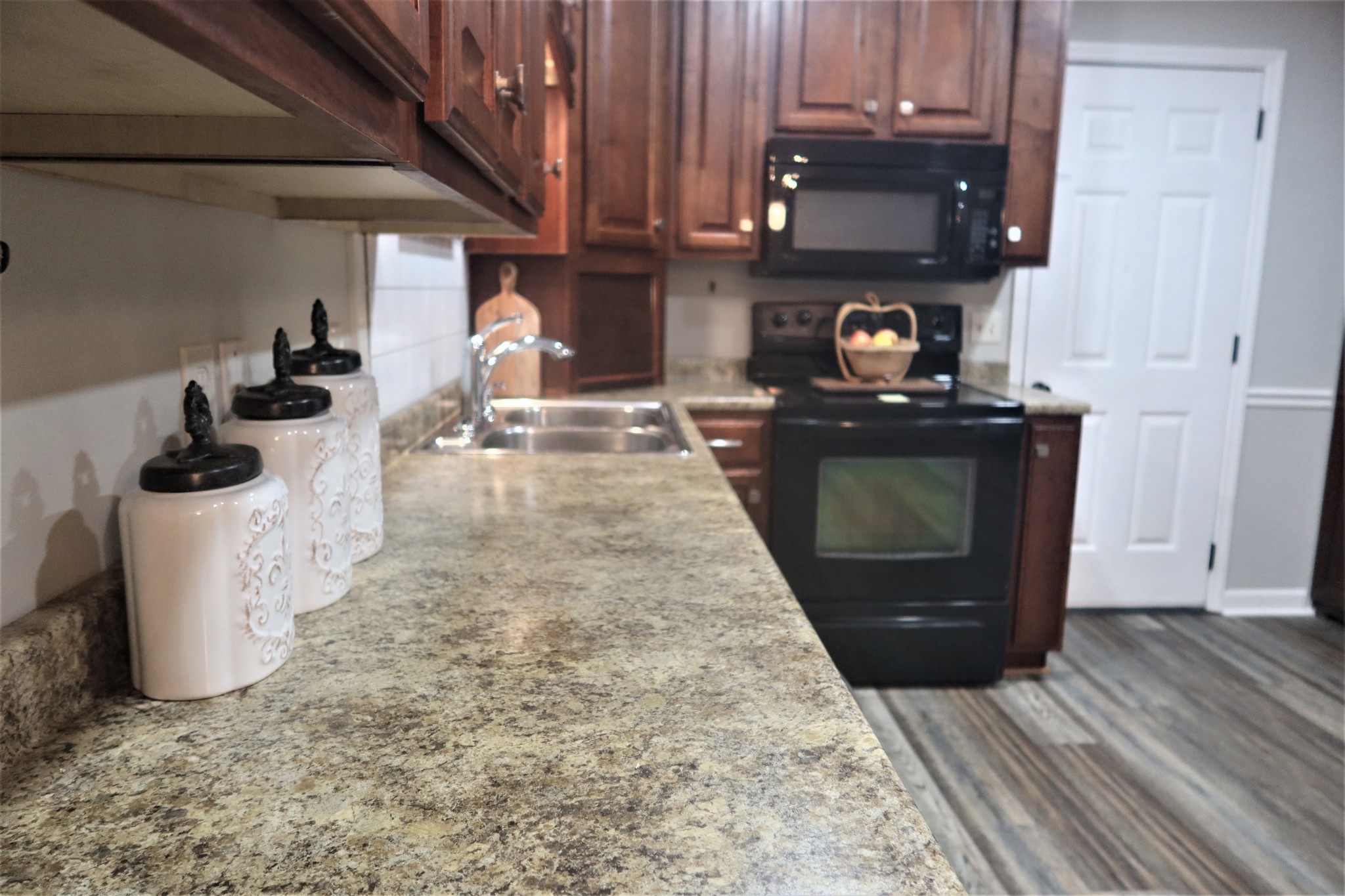 978 Riley Creek Road Tullahoma, TN 37388 - Photo 11 of 24 a kitchen with a stove and a refrigerator