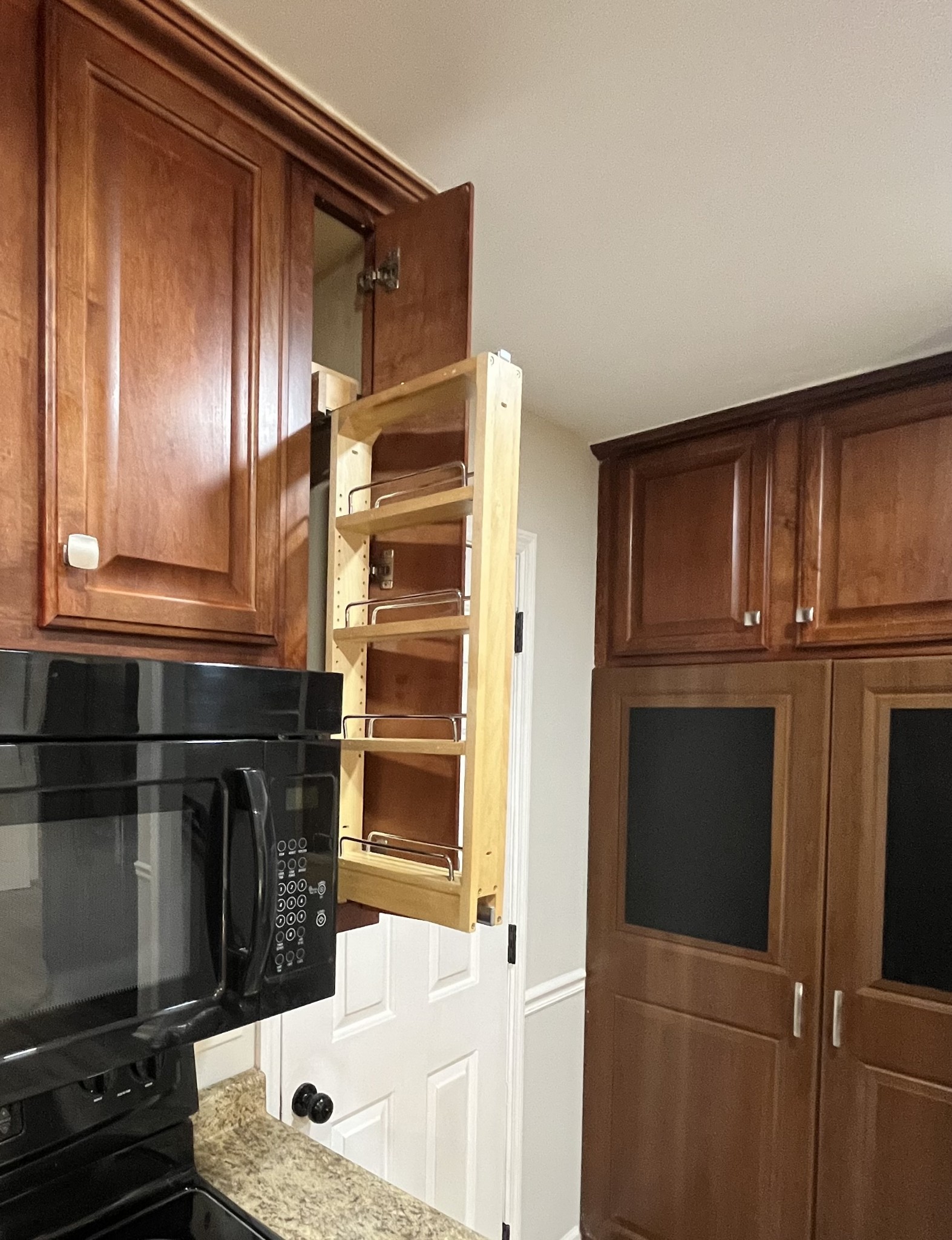 978 Riley Creek Road Tullahoma, TN 37388 - Photo 9 of 24 a bathroom with granite countertop a sink and a refrigerator