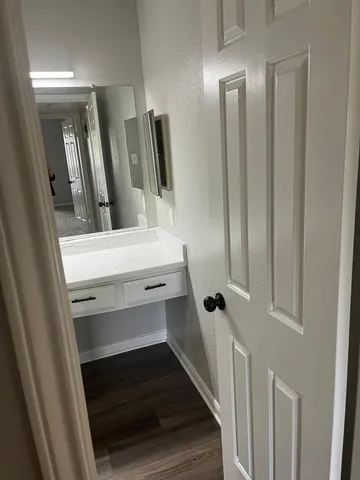 a bathroom with a sink and mirror