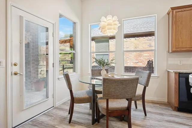 a dining room with furniture window wooden floor