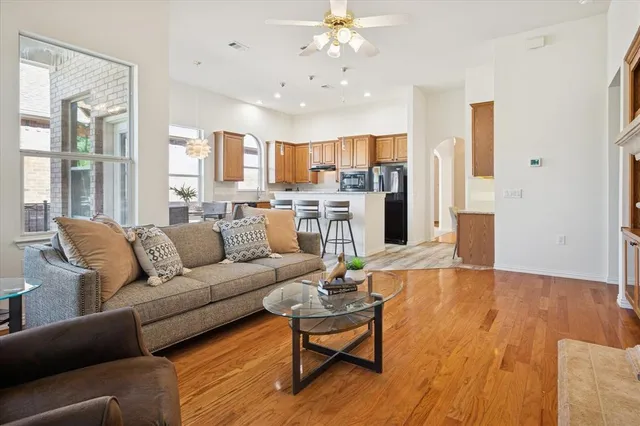 a living room with furniture and kitchen view