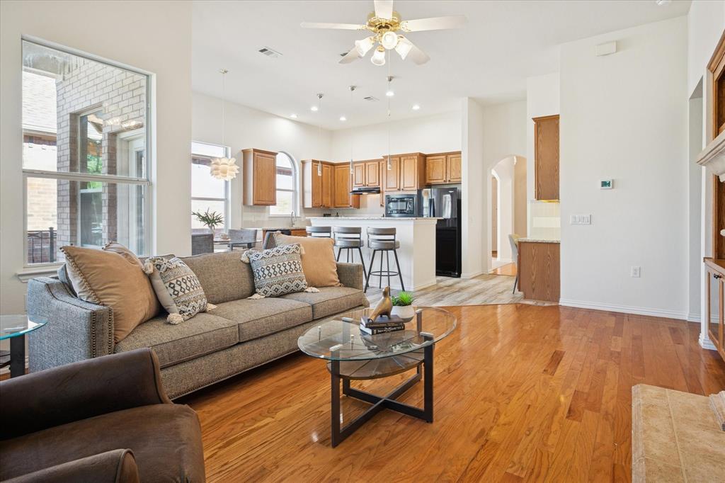 351 Rio Bravo Drive Fairview, TX 75069 - Photo 13 of 20 a living room with furniture and kitchen view