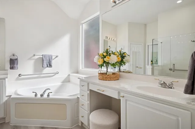 a bathroom with a sink toilet and a mirror