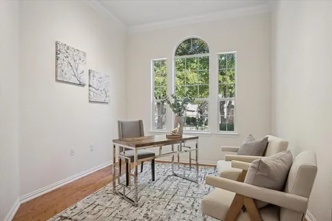 a workspace with furniture and a window