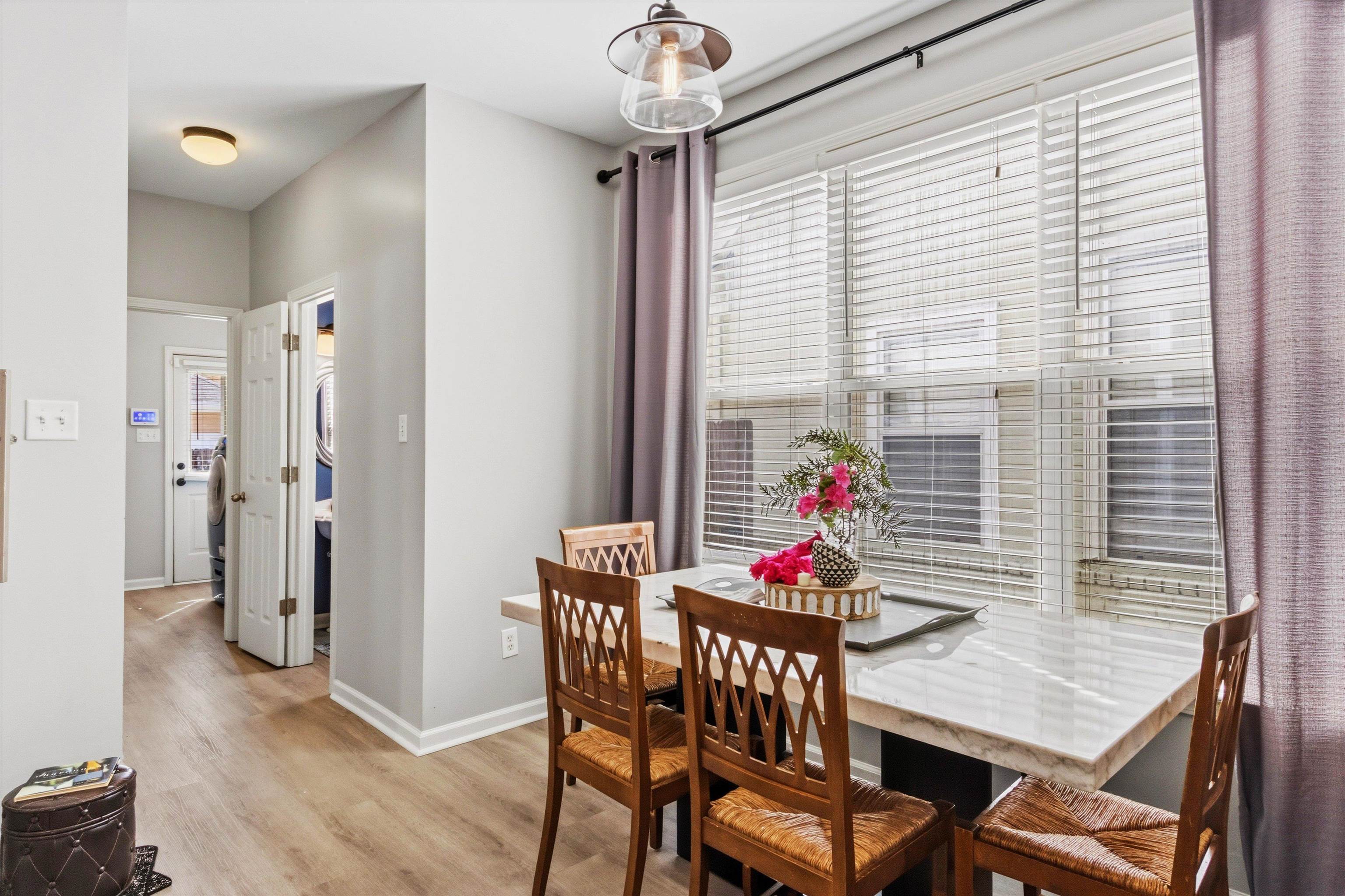 1182 Isle View Drive Memphis, TN 38103 - Photo 11 of 27 a view of a dining room with furniture and a window