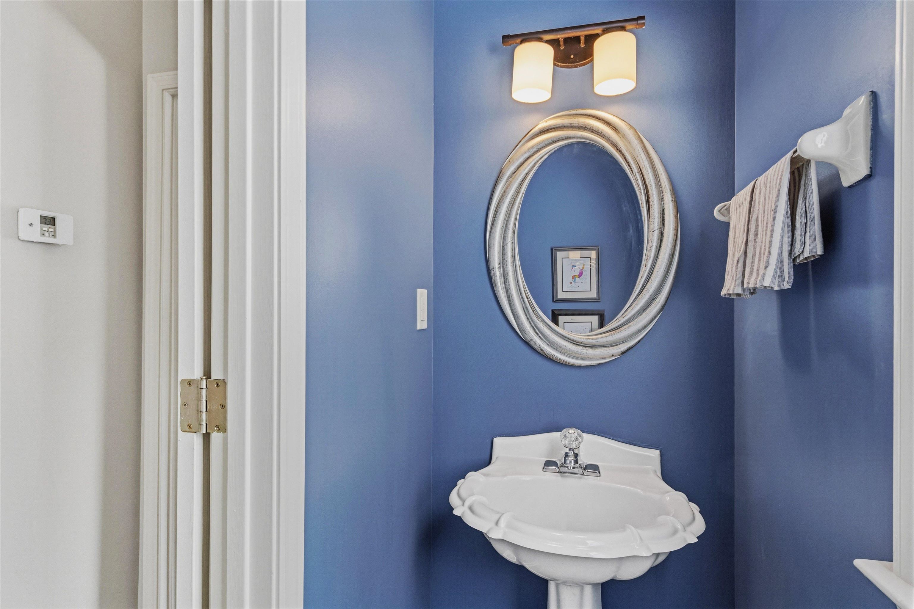 1182 Isle View Drive Memphis, TN 38103 - Photo 21 of 27 a bathroom with a sink and a mirror