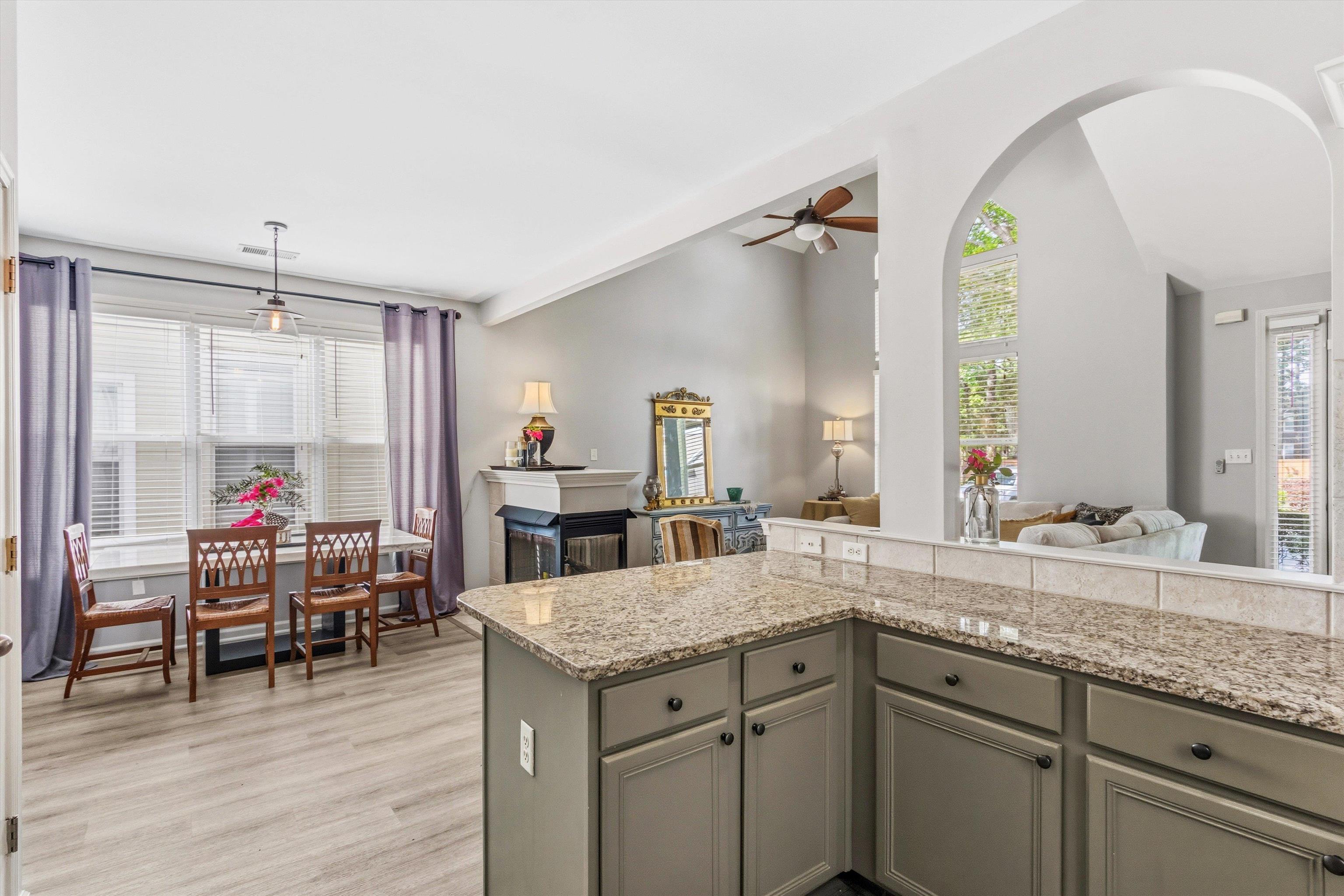 1182 Isle View Drive Memphis, TN 38103 - Photo 8 of 27 a bathroom with a granite countertop sink and a mirror