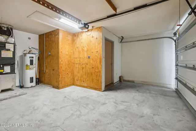 a view of empty room with ceiling fan