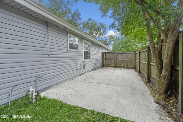 a view of backyard with green space