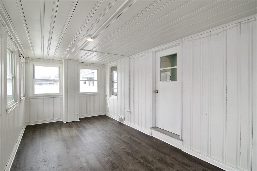 49 Rimmon Avenue Springfield, MA 01107 - Photo 6 of 32 an empty room with wooden floor and windows