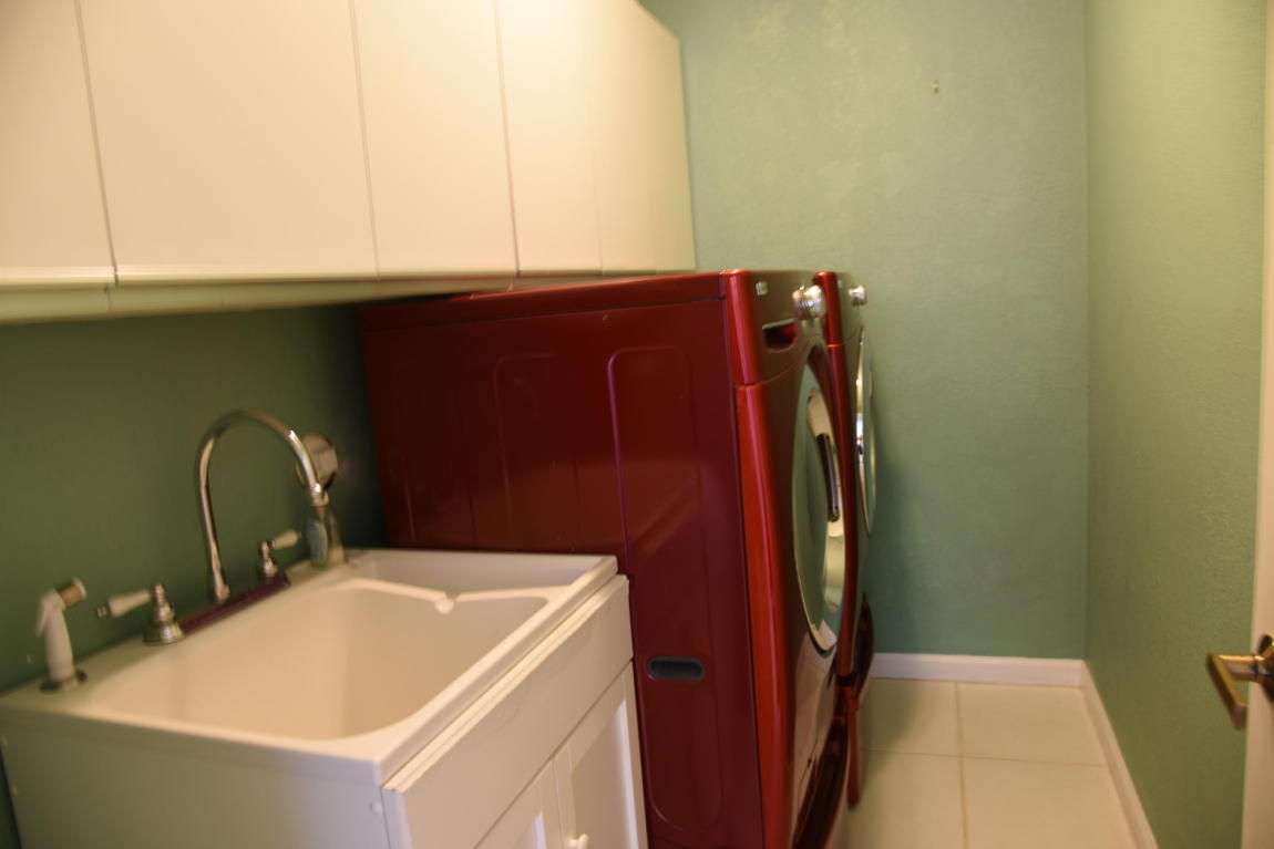 4465 Northwest 28th Way Boca Raton, FL 33434 - Photo 16 of 22 a bathroom with a sink and a mirror