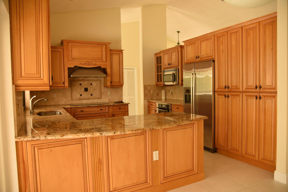 4465 Northwest 28th Way Boca Raton, FL 33434 - Photo 5 of 22 a bathroom with a sink a mirror and shower