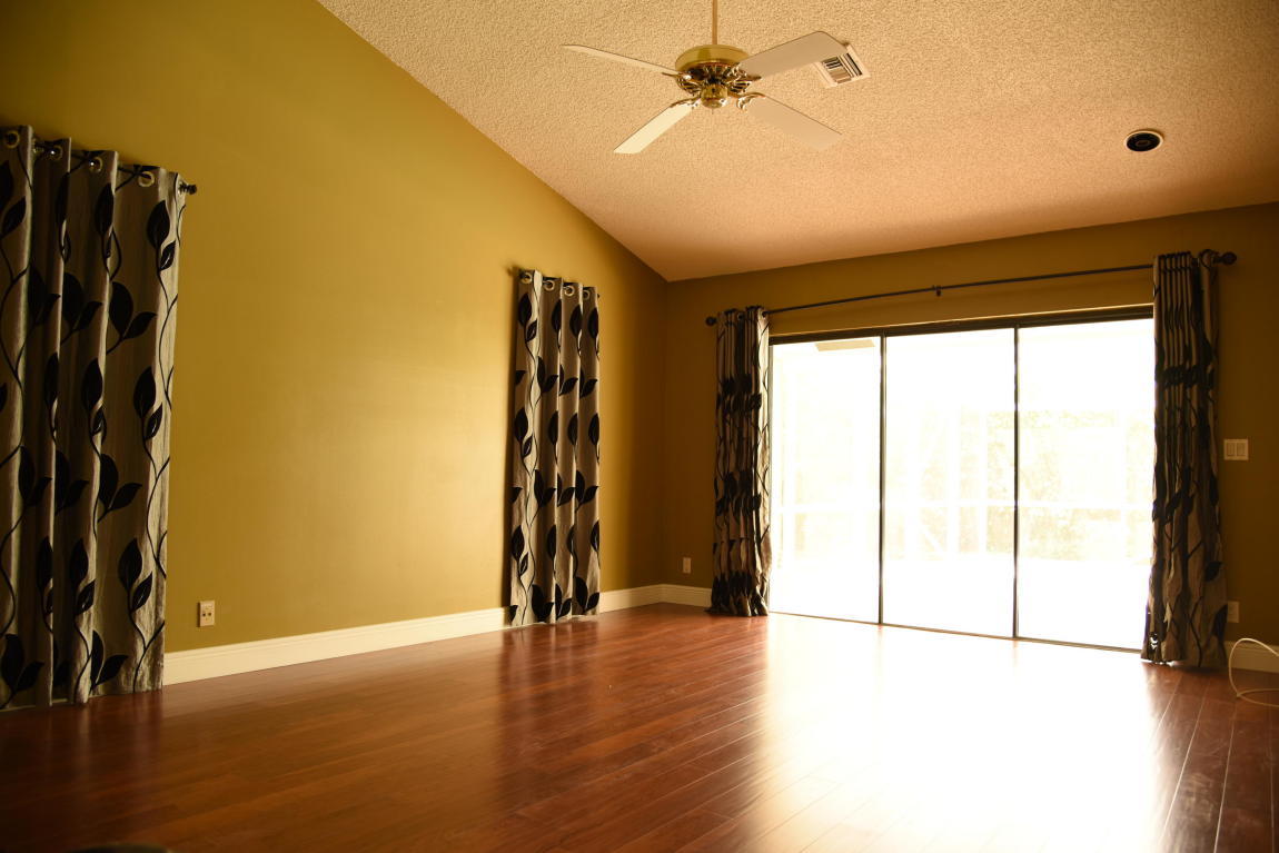 4465 Northwest 28th Way Boca Raton, FL 33434 - Photo 9 of 22 a view of room with window and hardwood floor
